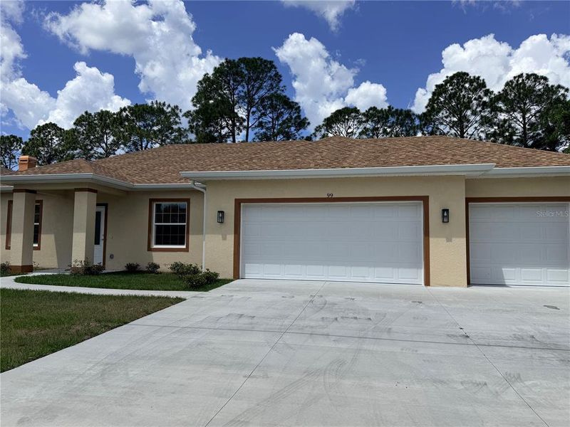 Front exterior of a new home in , Palm Coast, FL, highlighting curb appeal (Image 28).