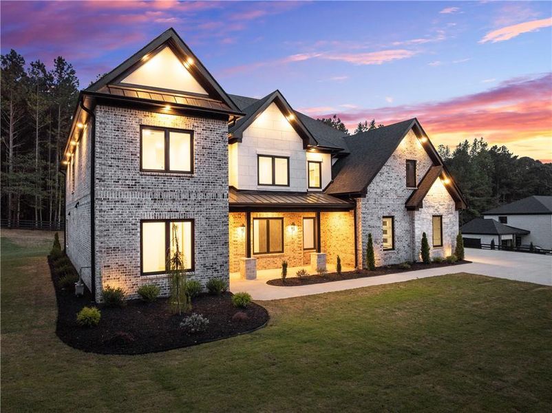 Front exterior of a new home in , Hoschton, GA, highlighting curb appeal (Image 2).