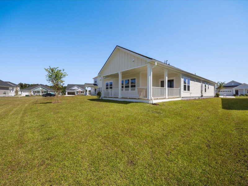 Exterior details and patio area of a home in The Coves at Lakes of Cane Bay, Summerville (Image 30). Exterior details and patio area of a home in The Coves at Lakes of Cane Bay, Summerville (Image 30).