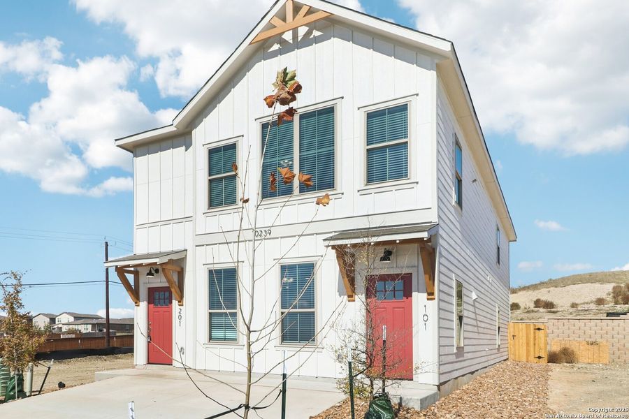 Front exterior of a new home in Magnolia Village, San Antonio, TX, highlighting curb appeal (Image 24). Front exterior of a new home in Magnolia Village, San Antonio, TX, highlighting curb appeal (Image 24).
