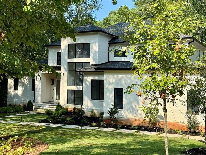 Front exterior of a new home in , Sandy Springs, GA, highlighting curb appeal (Image 28).