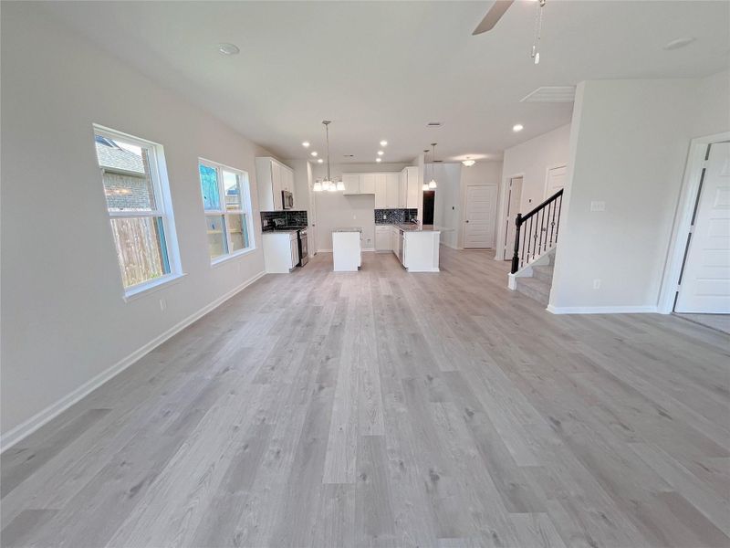 The Georgetown II- Family Room into Dining Area. Home under construction. Sample floor plan photo used for illustrative purposes only. Upgrades, selections options, windows and colors may vary.