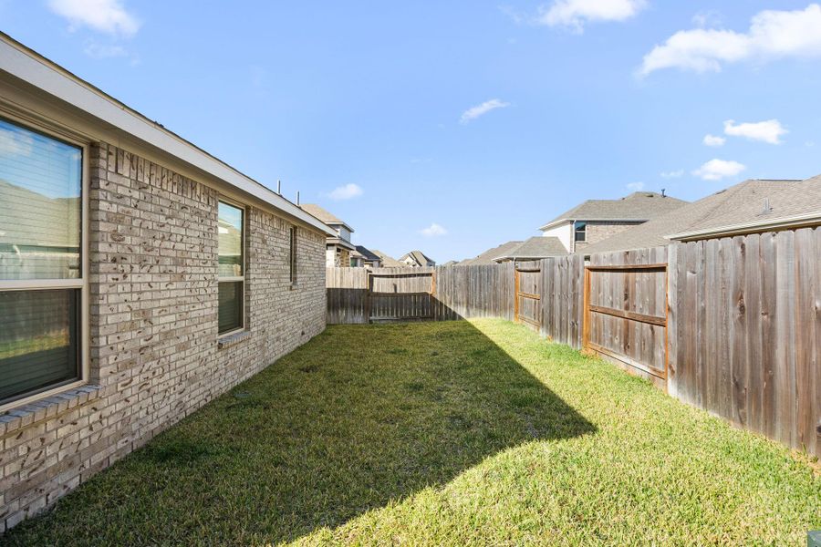 Exterior details and patio area of a home in Sunterra: Avante Collection, Katy (Image 23).