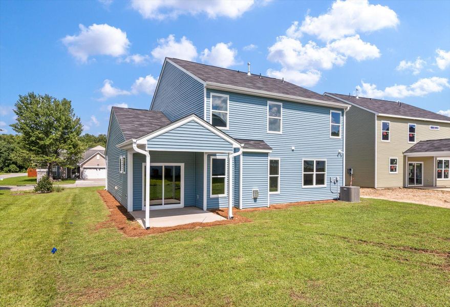Front exterior of a new home in Oakley Pointe, Moncks Corner, SC, highlighting curb appeal (Image 20).