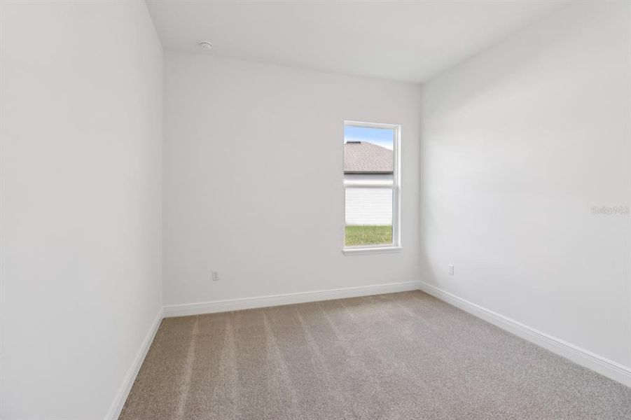 Spacious, unfurnished interior of a new home in Ardisia Park Estate, New Smyrna Beach (Image 6).