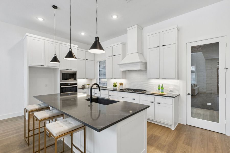 Representative furnished interior of a home built from the Roosevelt by Centre Living Homes in Newman Village Townhomes, Frisco (Image 14).