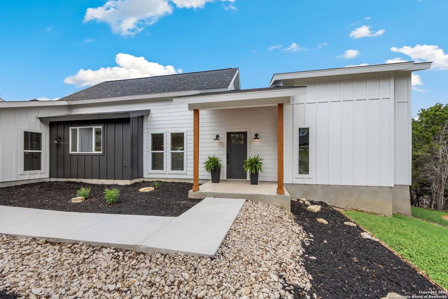 Front exterior of a new home in , Canyon Lake, TX, highlighting curb appeal (Image 27).