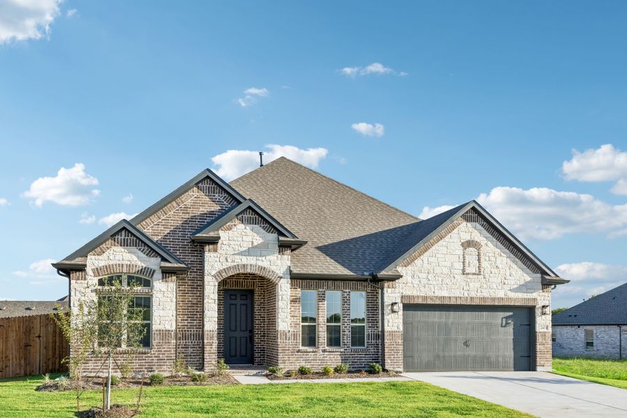 Front exterior of a new home in Sheppard's Place, Waxahachie, TX, highlighting curb appeal (Image 19). Front exterior of a new home in Sheppard's Place, Waxahachie, TX, highlighting curb appeal (Image 19).