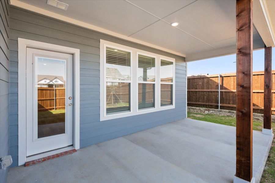 Exterior details and patio area of a home in Heritage Towne, Midlothian (Image 36).