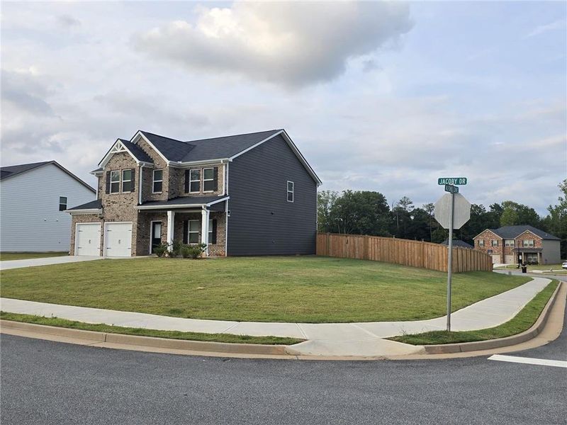 Front exterior of a new home in Fern Dale, Fairburn, GA, highlighting curb appeal (Image 33).