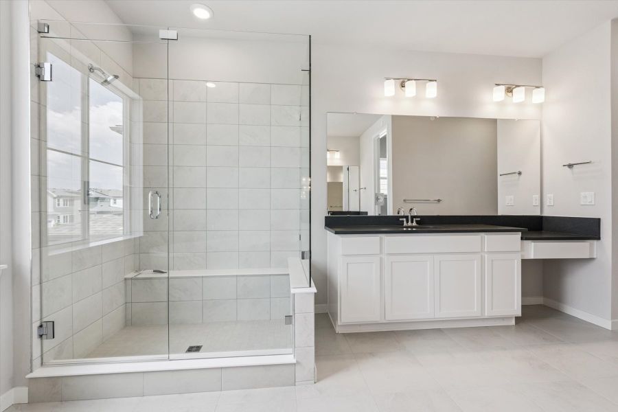 A bathroom with a glass shower.