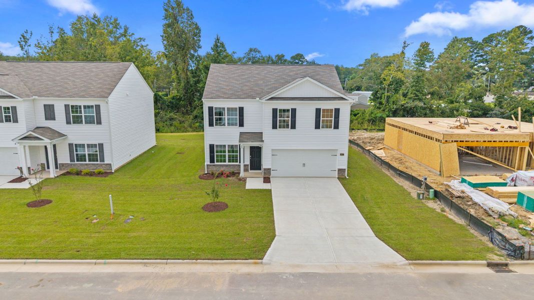 Front exterior of a new home in Madeline Farm, New Bern, NC, highlighting curb appeal (Image 15).