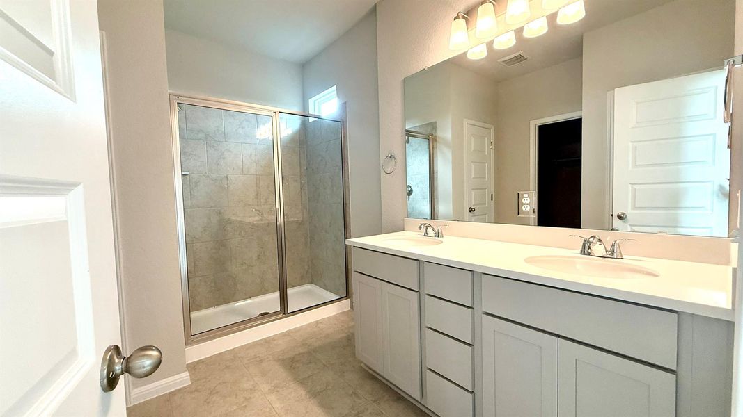 Primary Bath retreat with dual vanities & walk-in shower