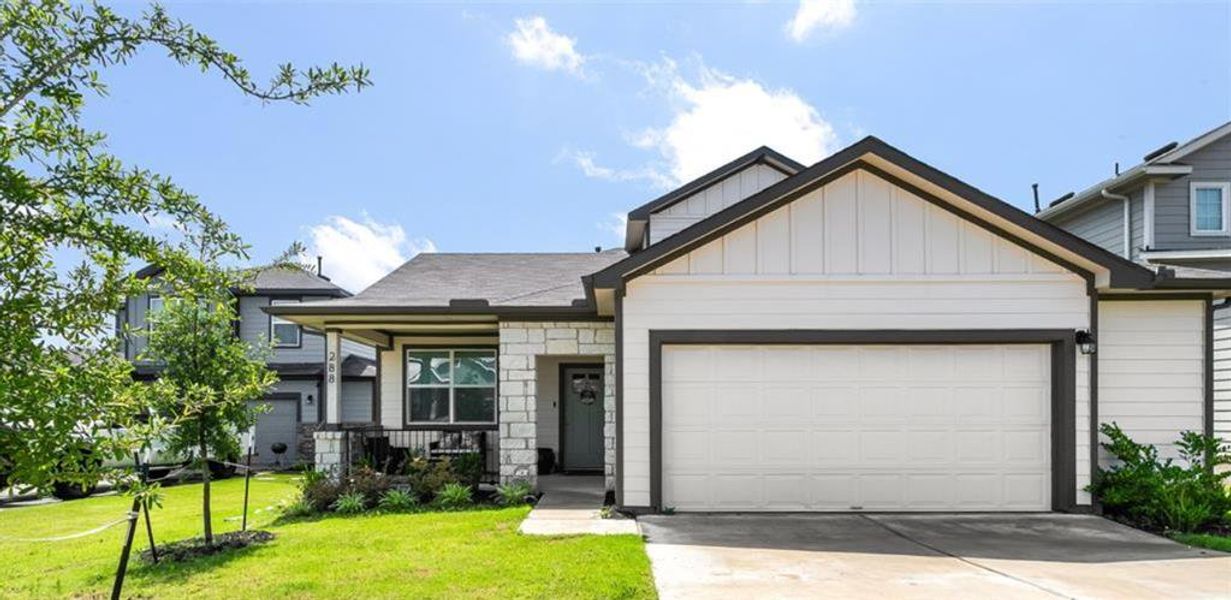 Front exterior of a new home in Talavera, Kyle, TX, highlighting curb appeal (Image 1). Front exterior of a new home in Talavera, Kyle, TX, highlighting curb appeal (Image 1).