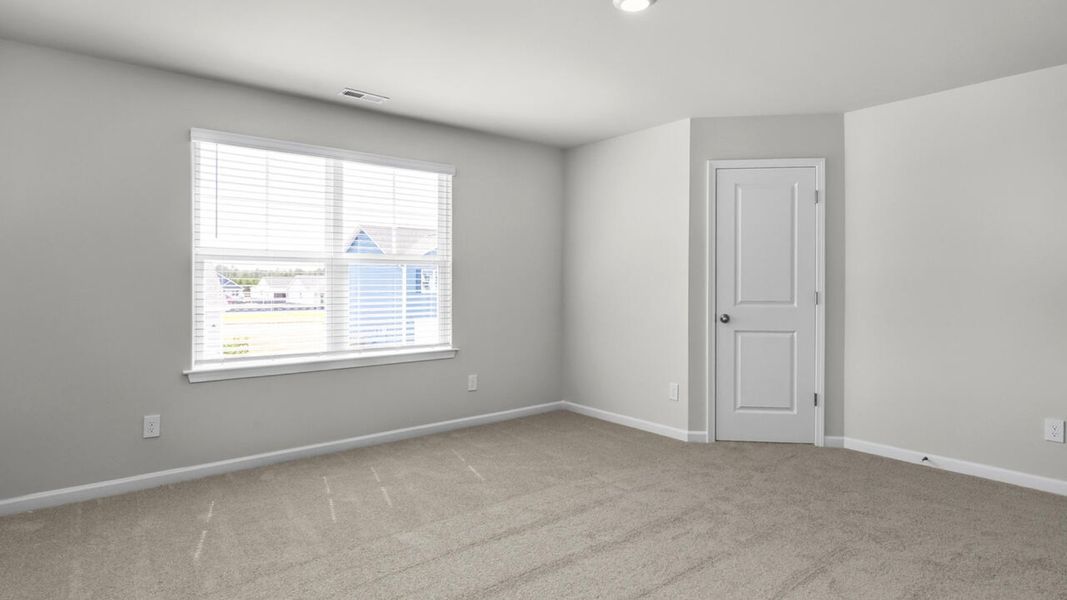 Spacious, unfurnished interior of a new home in Surfside Landing, Hubert (Image 25).