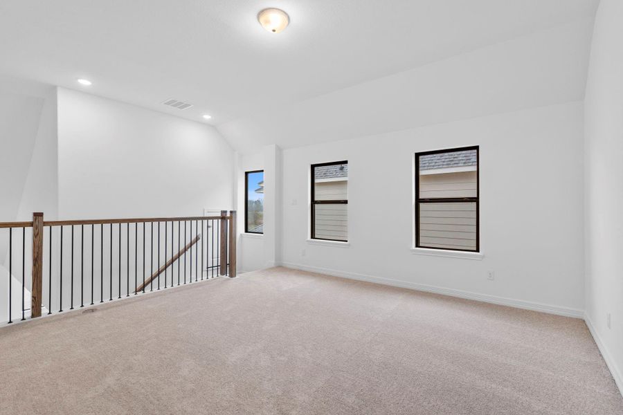 The loft provides an elevated living space perfect for relaxation, entertainment, or quiet moments.