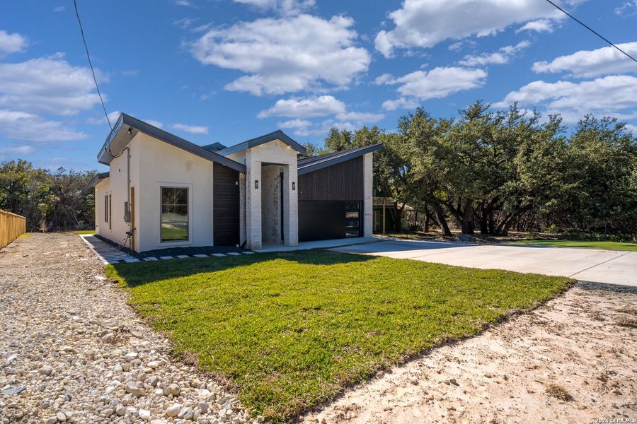 Front exterior of a new home in , Spring Branch, TX, highlighting curb appeal (Image 2). Front exterior of a new home in , Spring Branch, TX, highlighting curb appeal (Image 2).
