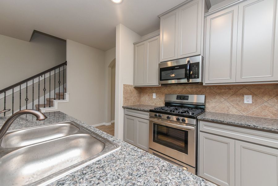 Representative furnished interior of a home built from the Floor Plan 2201 by Colina Homes in Grand Magnolia, Magnolia (Image 9).