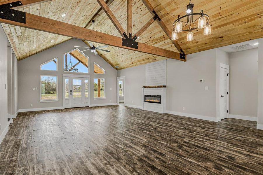 Open living and dining with cedar ceilings, gable. Electric Fireplace. LVP Floors throughout home.
