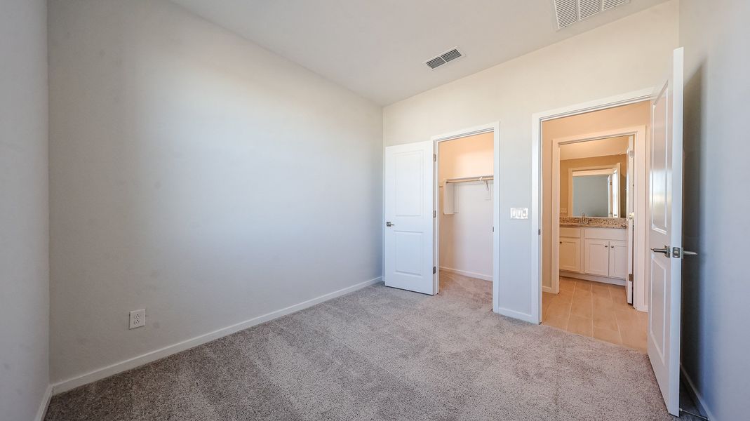 A hallway with white doors.