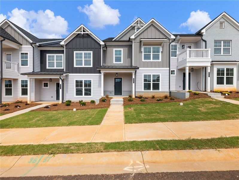 Front exterior of a new home in Apalachee Overlook, Winder, GA, highlighting curb appeal (Image 1). Front exterior of a new home in Apalachee Overlook, Winder, GA, highlighting curb appeal (Image 1).