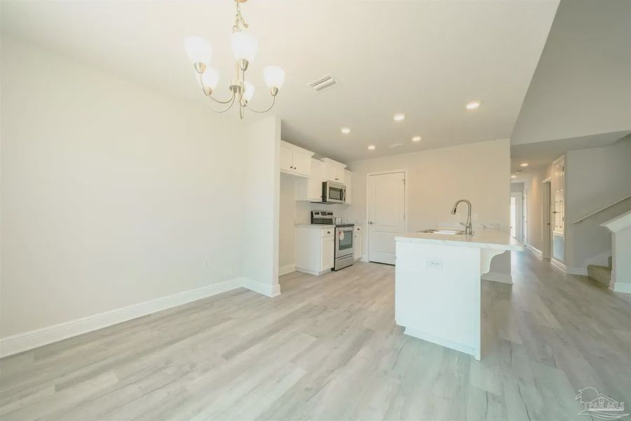Representative unfurnished interior of a home built from the Plan 1645 by Adams Homes in Westpointe Place, Pensacola (Image 7).