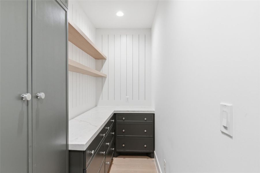 Designed for effortless entertaining, this beautifully appointed butler’s pantry offers additional storage, prep space, and a seamless extension of the main kitchen.