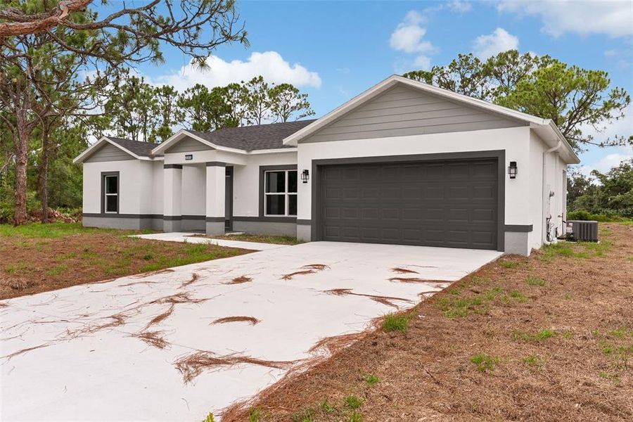 Front exterior of a new home in , Sebring, FL, highlighting curb appeal (Image 2). Front exterior of a new home in , Sebring, FL, highlighting curb appeal (Image 2).