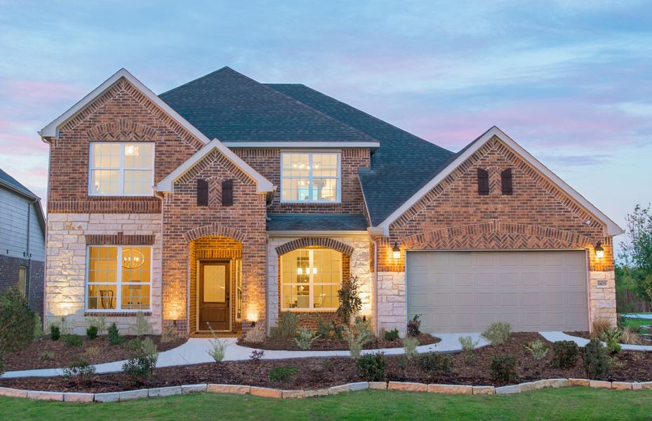 Exterior D model home with stone accents and covered front porch