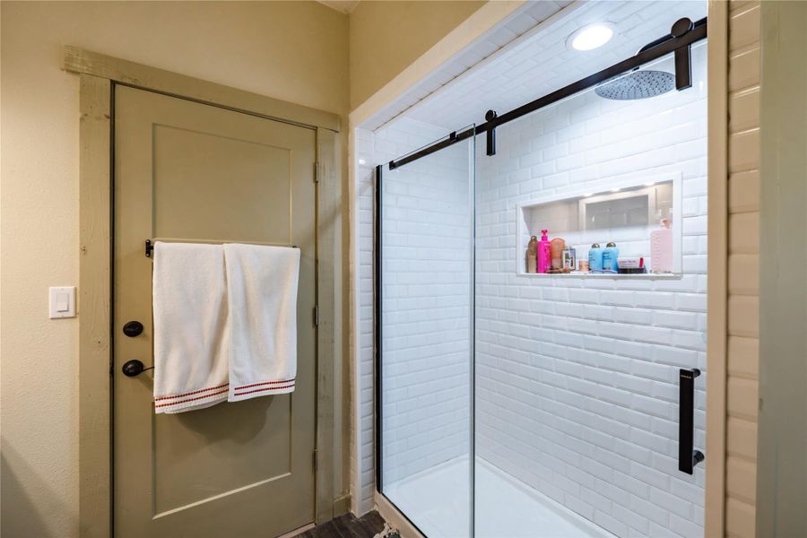 Ensuite bathroom tied to guest bedroom featuring walk-in shower Ensuite bathroom tied to guest bedroom featuring walk-in shower