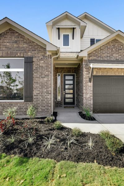 Front exterior of a new home in Blackhawk, Pflugerville, TX, highlighting curb appeal (Image 28).