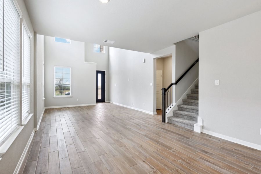 Dining room and living room in the Medina floorplan at a Meritage Homes community.