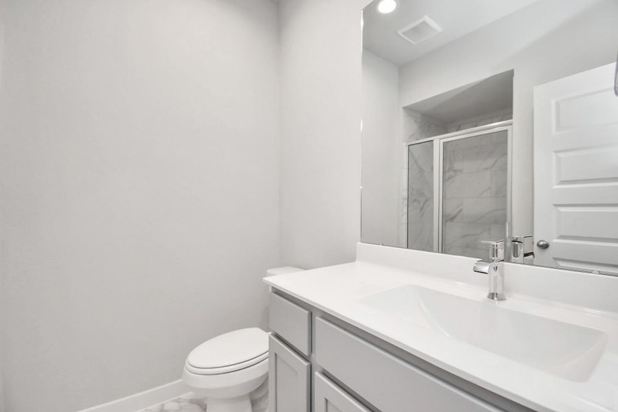 Full Guest suite bath with walk in shower. Sample photo of completed home with similar floor plan. As-built interior colors and selections may vary Full Guest suite bath with walk in shower. Sample photo of completed home with similar floor plan. As-built interior colors and selections may vary