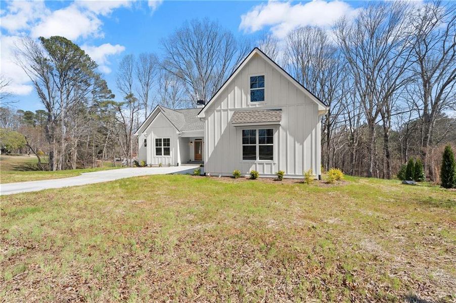 Front exterior of a new home in , Waleska, GA, highlighting curb appeal (Image 18). Front exterior of a new home in , Waleska, GA, highlighting curb appeal (Image 18).