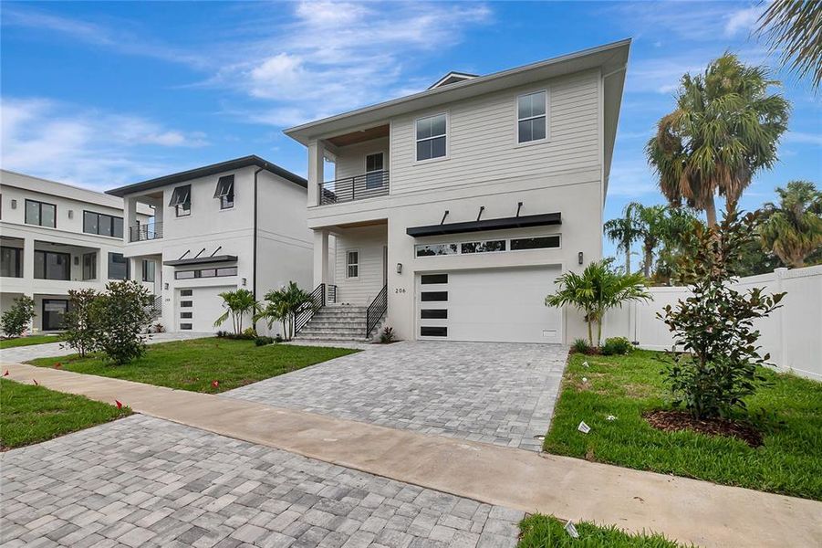 Front exterior of a new home in , Tampa, FL, highlighting curb appeal (Image 1). Front exterior of a new home in , Tampa, FL, highlighting curb appeal (Image 1).