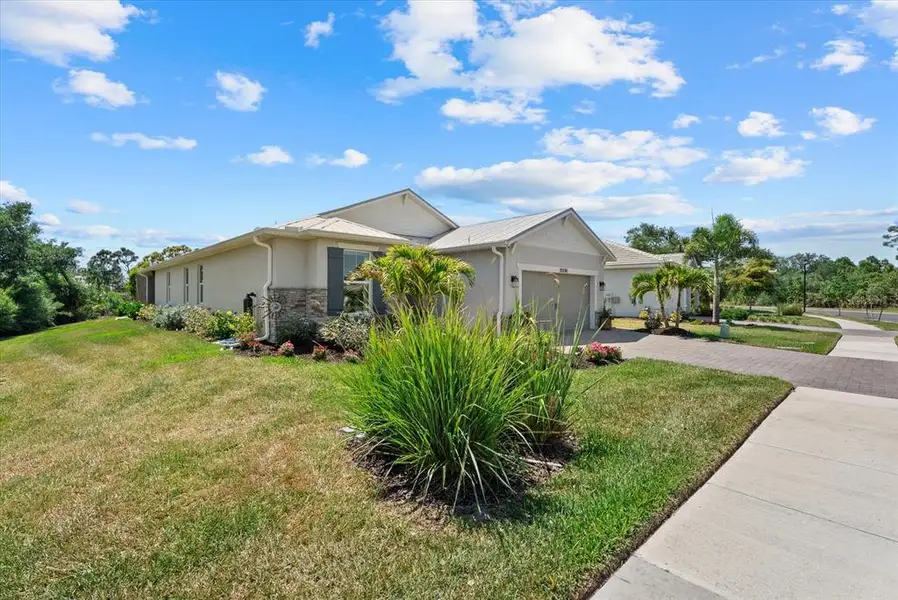Front exterior of a new home in , Englewood, FL, highlighting curb appeal (Image 25).