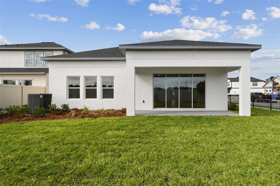 Exterior details and patio area of a home in Oakfield at Mount Dora Village Series, Mount Dora (Image 25).