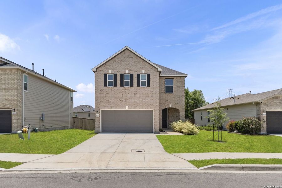 Front exterior of a new home in Parklands, Schertz, TX, highlighting curb appeal (Image 28).