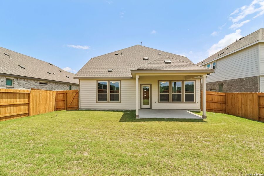 Exterior details and patio area of a home in Stream Waters, Seguin (Image 18).