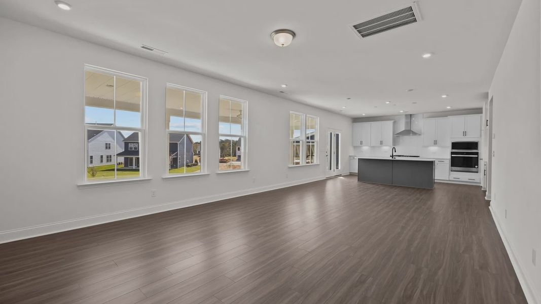 Burton Design open concept with large windows for abundant natural light. At Lakeside Glen by DRB Homes, York, SC