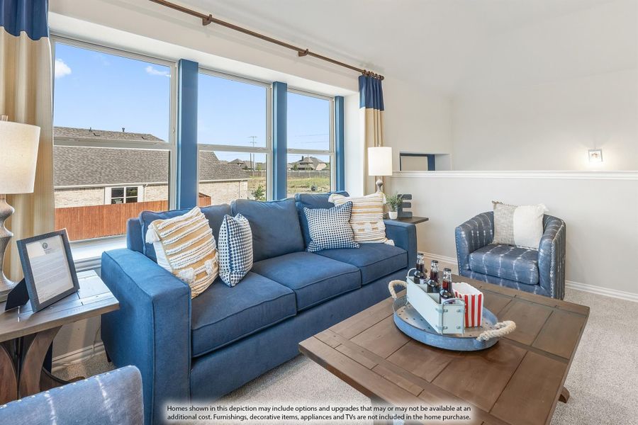 Living room with blue sofa, wood coffee table, and large windows with neighborhood views Living room with blue sofa, wood coffee table, and large windows with neighborhood views