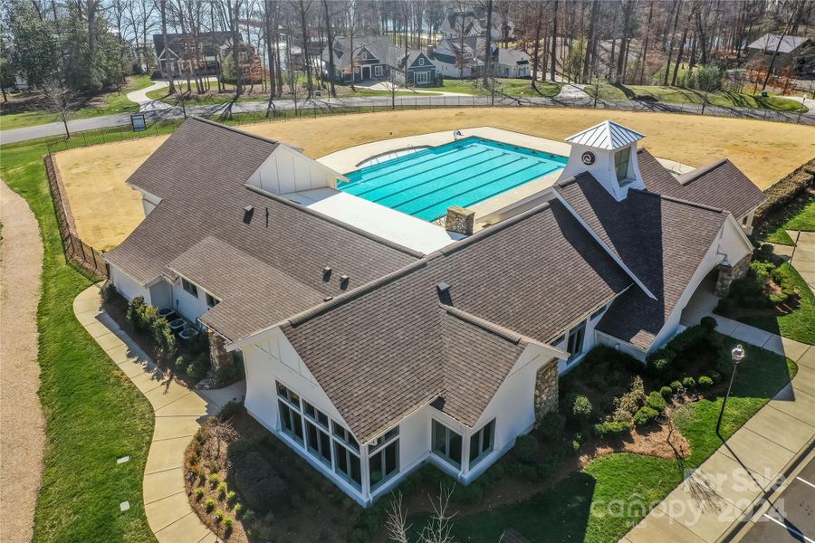 Beautiful pool/ clubhouse and fitness area  is a short golf cart ride from the property