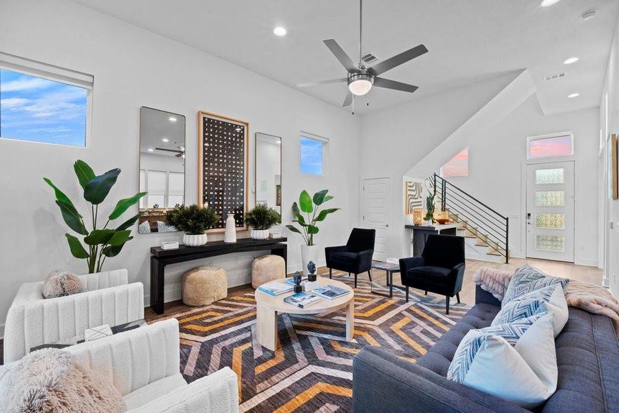 Living room with ceiling fan, stairway, recessed lighting, and wood finished floors