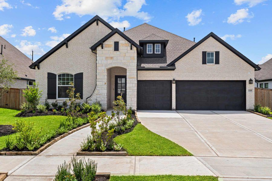 Representative exterior photo of a completed home built from the The Bynum by David Weekley Homes in Sienna 65' Homesites, Missouri City, TX (Image 1). Representative exterior photo of a completed home built from the The Bynum by David Weekley Homes in Sienna 65' Homesites, Missouri City, TX (Image 1).