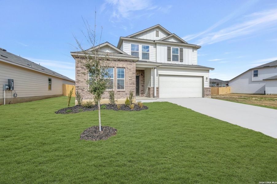 Front exterior of a new home in Greenspoint Heights, Seguin, TX, highlighting curb appeal (Image 21).