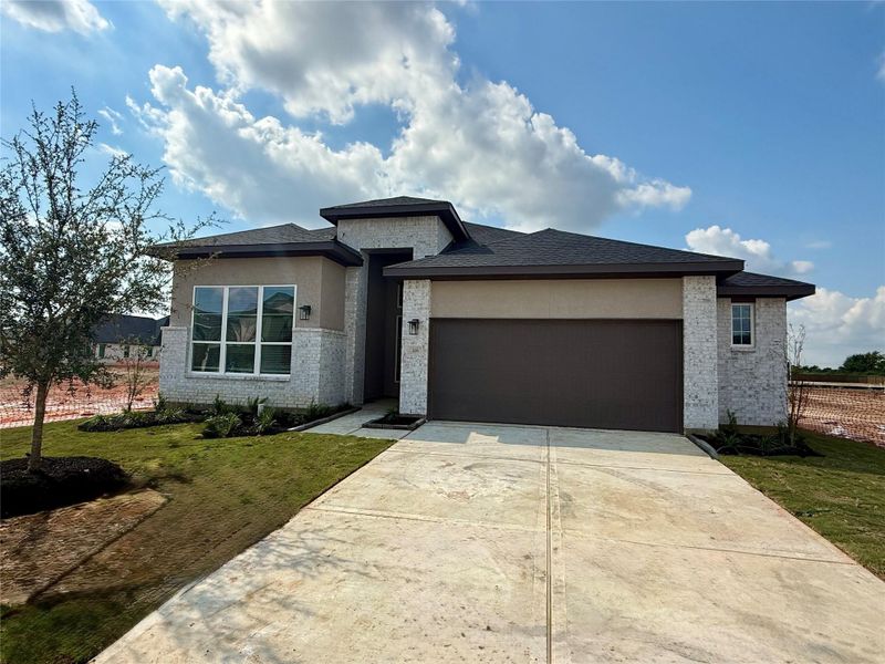 Front exterior of a new home in Attwater, Waller, TX, highlighting curb appeal (Image 22).