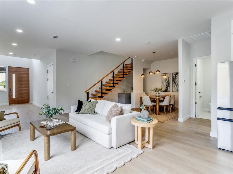 Entryway featuring light wood-finish flooring, recessed ceiling lighting, and crisp white walls Entryway featuring light wood-finish flooring, recessed ceiling lighting, and crisp white walls