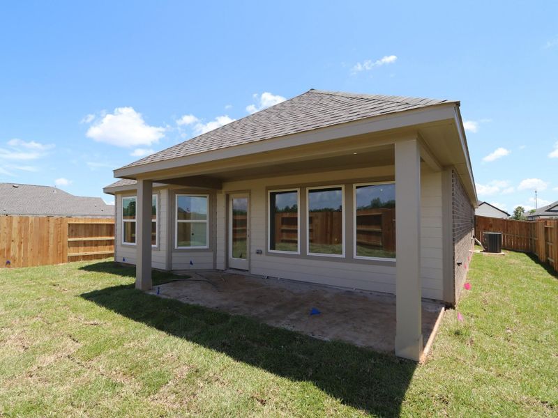 Front exterior of a new home in Lago Mar, Santa Fe, TX, highlighting curb appeal (Image 1). Front exterior of a new home in Lago Mar, Santa Fe, TX, highlighting curb appeal (Image 1).