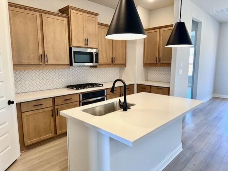 Furnished interior view inside a new home in Heritage, Dripping Springs (Image 11).