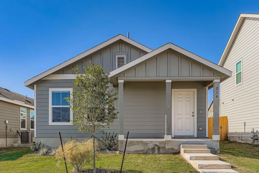 Front exterior of a new home in , Kyle, TX, highlighting curb appeal (Image 1).